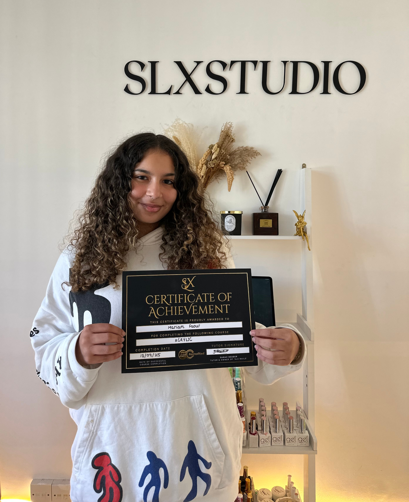 SLX Acrylic student with certificate at SLX Studio